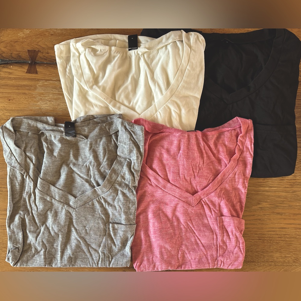 Women’s light weight tee shirts 4 pack all Large. Colors white,pink,gray,black